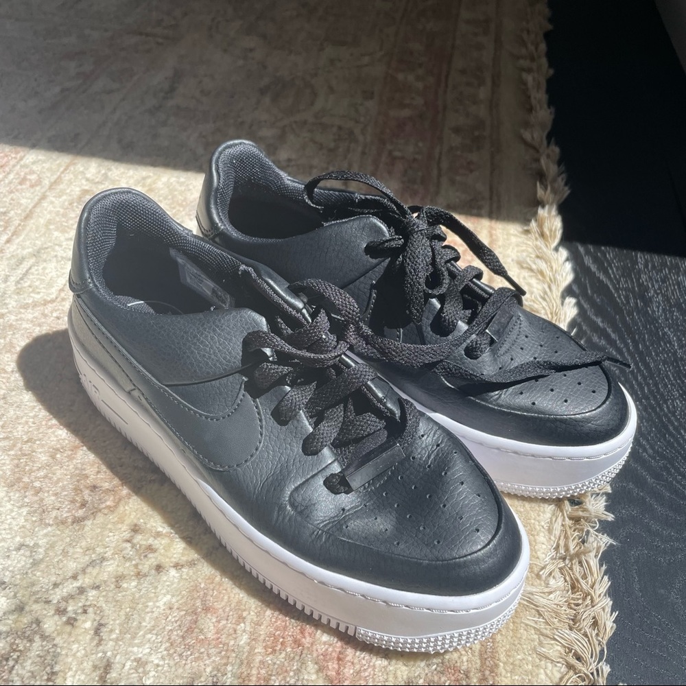 Nike Air Force 1s Platforms in black leather